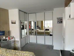 L sharped fitted wardrobe with a mix of wood and mirror, fitted in Seaton Carew